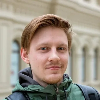 Portrait of a man wearing a green jacket outdoors